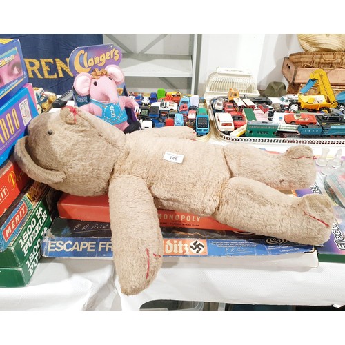 145 - An early edition of Escape from Colditz, instructions missing, Monopoly and two soft toys. No shippi... 