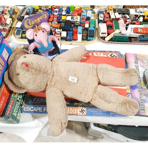 145 - An early edition of Escape from Colditz, instructions missing, Monopoly and two soft toys. No shippi... 