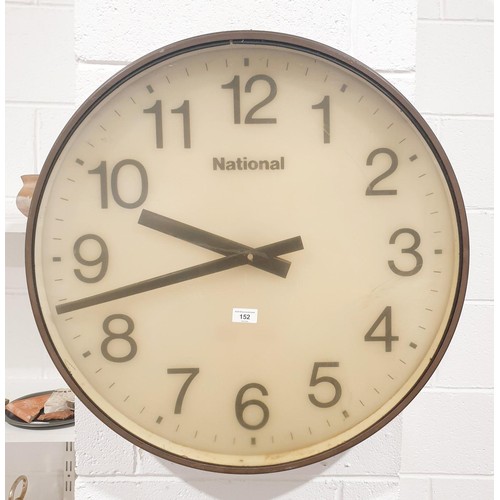 152 - A large National electric wall clock in a copper bezel, diameter 71cm. No shipping. Arrange collecti... 