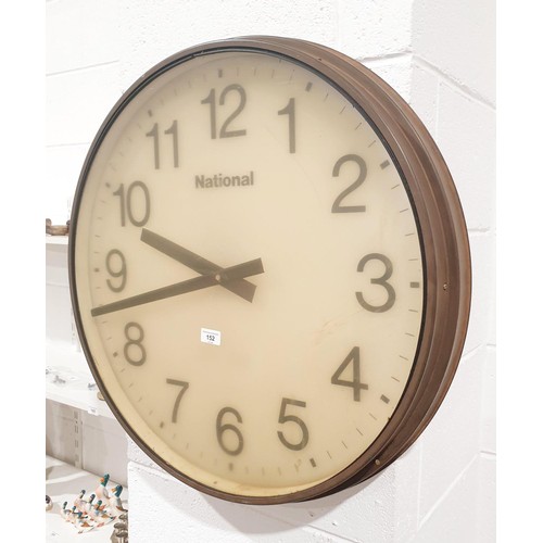 152 - A large National electric wall clock in a copper bezel, diameter 71cm. No shipping. Arrange collecti... 