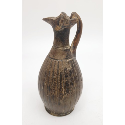 154 - An ancient ceramic Apulian/Greek Oinochoe, having ribbed body and trefoil mouth, height 13cm. No shi... 