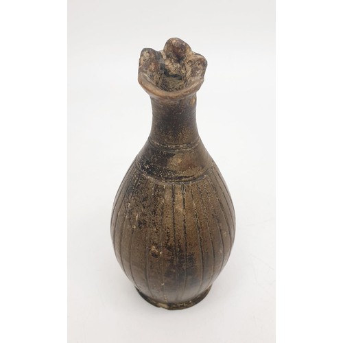 154 - An ancient ceramic Apulian/Greek Oinochoe, having ribbed body and trefoil mouth, height 13cm. No shi... 
