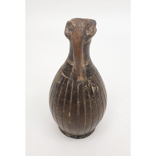 154 - An ancient ceramic Apulian/Greek Oinochoe, having ribbed body and trefoil mouth, height 13cm. No shi... 