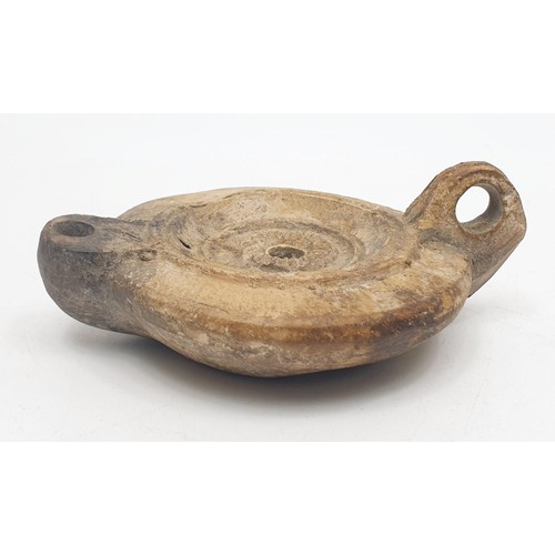156 - An ancient Roman ceramic oil lamp, width 11cm. No shipping. Arrange collection or your own packer an... 