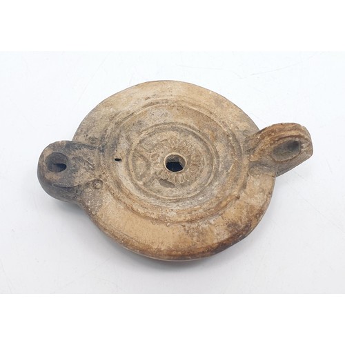 156 - An ancient Roman ceramic oil lamp, width 11cm. No shipping. Arrange collection or your own packer an... 
