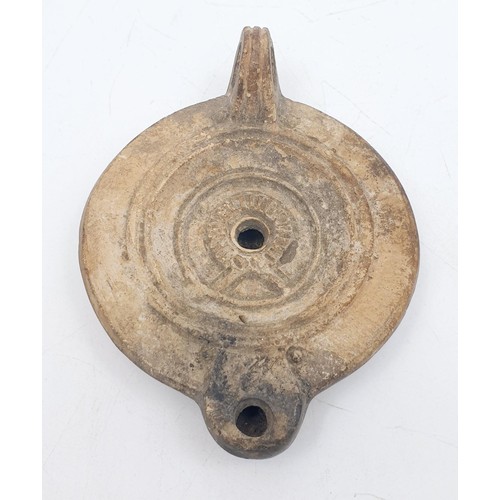 156 - An ancient Roman ceramic oil lamp, width 11cm. No shipping. Arrange collection or your own packer an... 