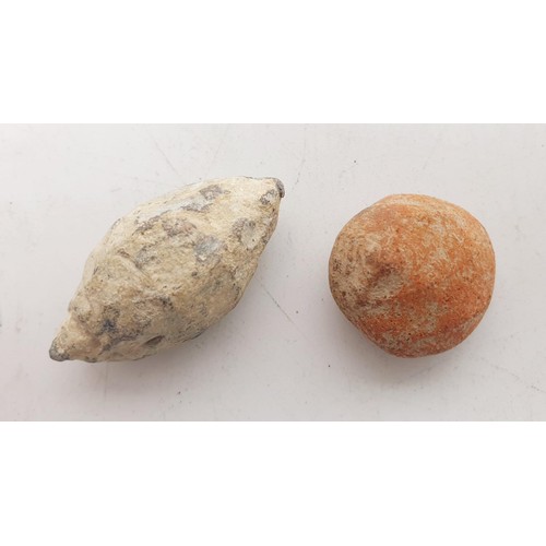 178 - A metal Roman sling shot, length 4cm together with a Roman terracotta artifact. No shipping. Arrange... 