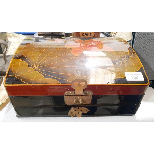 139 - A lacquered jewellery box and contents including silver. In house shipping available excluding the U... 
