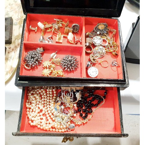 139 - A lacquered jewellery box and contents including silver. In house shipping available excluding the U... 