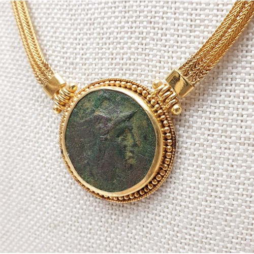 8 - A 14ct gold necklace set with an ancient Greek bronze coin, length 41cm, gross weight 29.33g. In hou... 