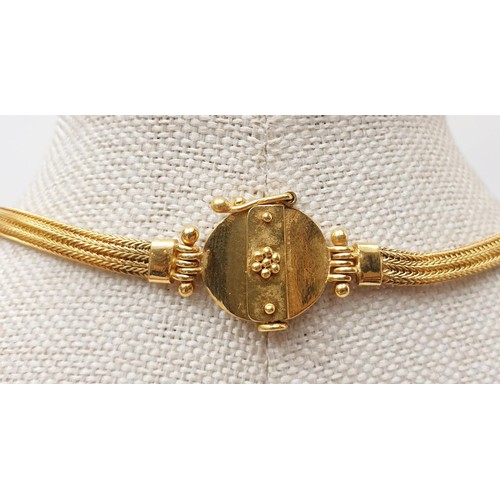 8 - A 14ct gold necklace set with an ancient Greek bronze coin, length 41cm, gross weight 29.33g. In hou... 