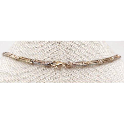 21 - A 925 silver and mother of pearl and Greek key motif necklace, gross weight 18g. In house shipping a... 