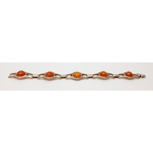 22 - A 925 silver and amber bracelet, length 19cm, gross weight 27g. In house shipping available.