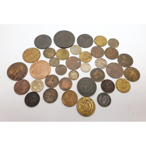 38 - A selection of coins and tokens including silver. In house shipping available.