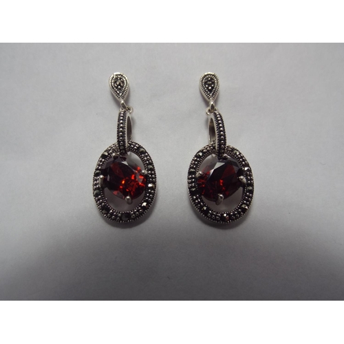 53 - Pair of 925 silver marcasite set with garnets