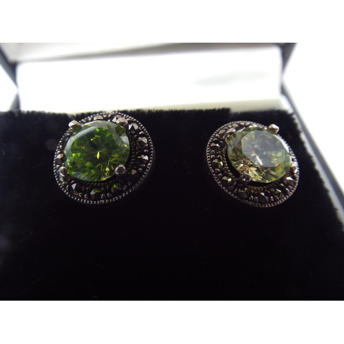 55 - Pair of 925 silver marcasite earstuds set with Peridots