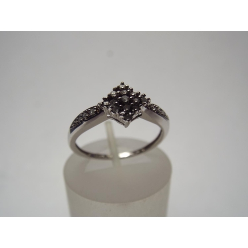 63 - 9ct White gold ring set with multiple Diamonds 10pts of Diamonds. 2.0 g Finger size 'O'