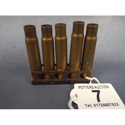 7 - Five 303 Bullet shells on clip magazine