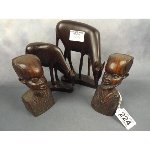 224 - Two carved hardwood busts and antelope figures.