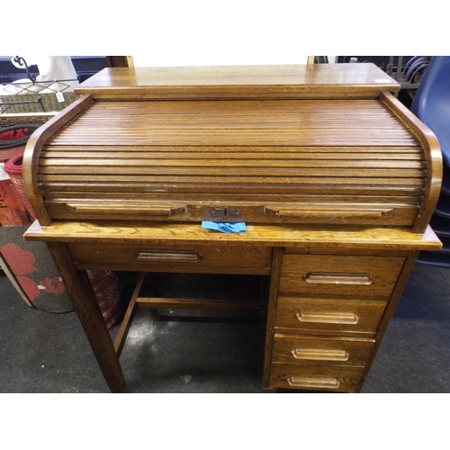 325 - 1920's Oak Rolled top desk with drawers under