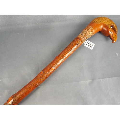 206 - Hand carved walking cane with eagles head & glass eyes