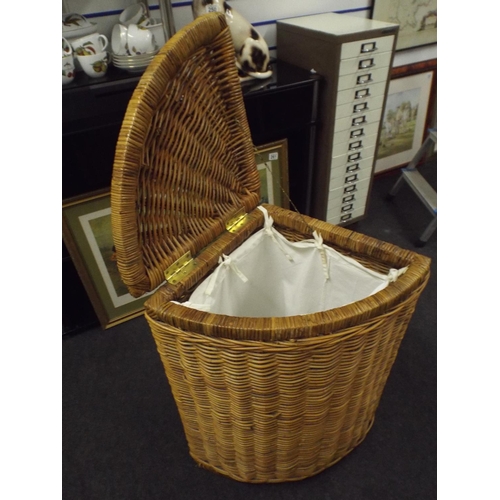 290 - Wicker made corner laundry basket with linnen inside.