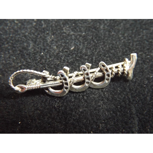 47 - 925 silver Riding crop brooch.