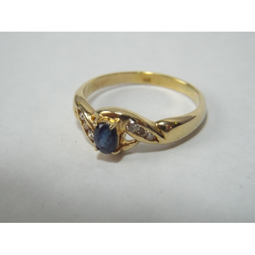 41 - 9ct Gold Ring, Central Sapphire with Diamond Surround. 5.0g   Finger size V