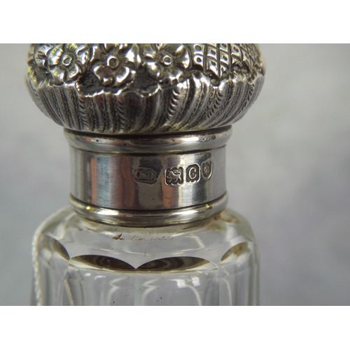 113 - Large Glass & Silver topped Bottle. Scrolled Silver top hallmarked for Birmingham 1898