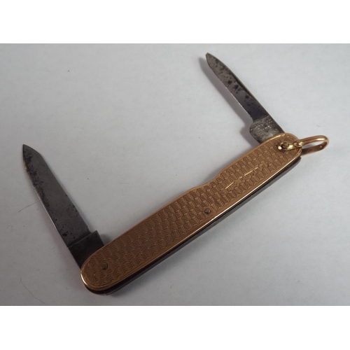 14 - 9ct Gold Engine Turned penknife. Hallmarked for Birmingham 1945.