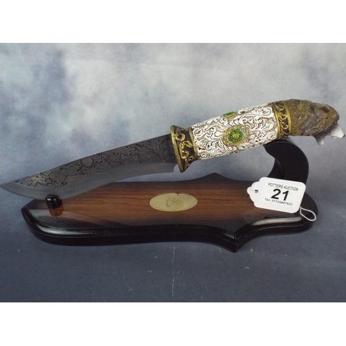 21 - Collectors knife with engraved blade and wolf head handle with display stand