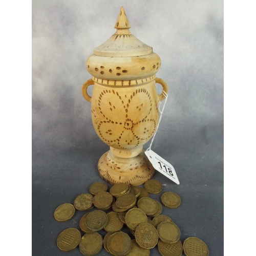 118 - Assortment of pre decimal Threepenny bits contained in pyrographed wooden urn.