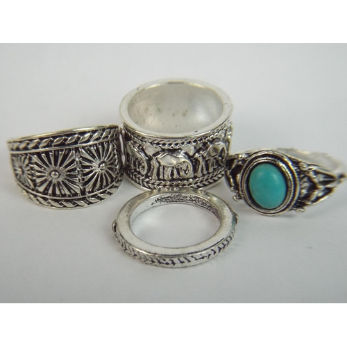 50 - Four White metal ornamental Rings