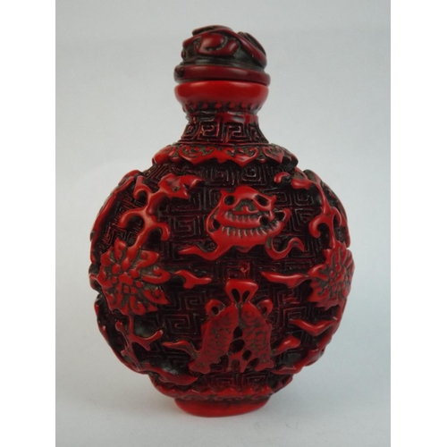 62 - Small Carved Oriental Scent Bottle. 3 inches tall.