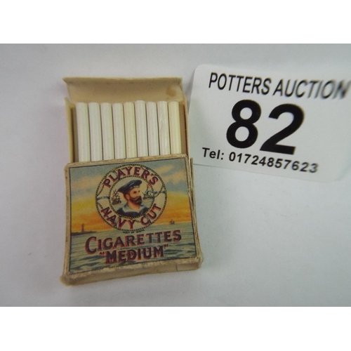 82 - Miniature packet of Players Cigarettes complete with toy cigarettes