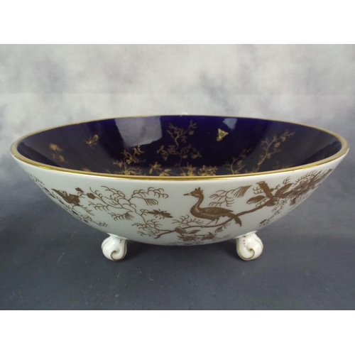 8 - Coalport enamelled bone china bowl on three feet, Slight a/f to foot.