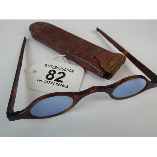 82 - Pair of vintage childs or ladies tinted glasses in tortoishell frames plus leather case.