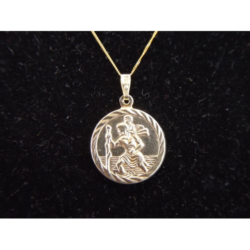 101 - 9ct Gold St Christopher Pendant on an 18 inch 9ct gold chain.  1.7g