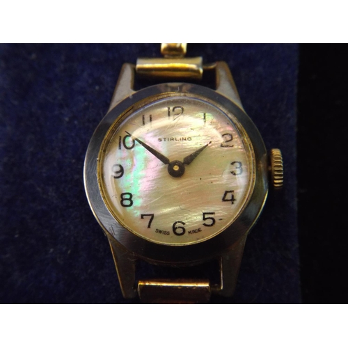 126 - Vintage ladies Swiss watch, Mother of pearl face with rolled gold strap. Working order.