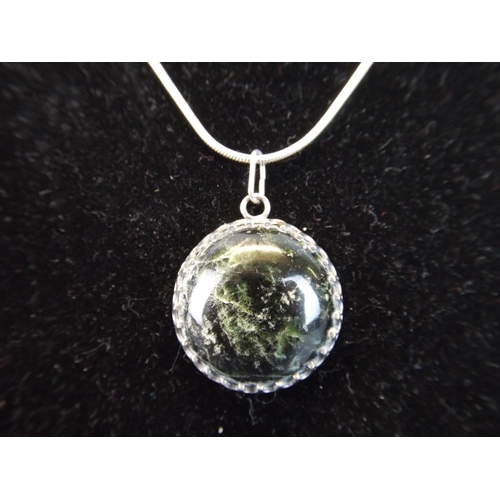 91 - Silver mounted Moss agate pendant. Edinburgh 1989 on 925 18 inch silver chain.