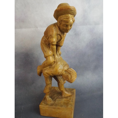 182 - Handcarved statue of leapfroging boys. Carved from one piece of wood.  12 inches tall.