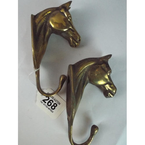 268 - Two Brass Horse Head Coat Hooks.