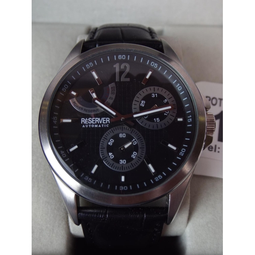 106 - Reserver,  Automatic watch. As new with leather strap and box.