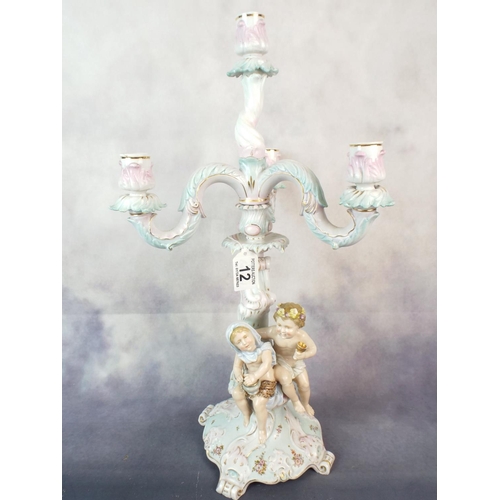 12 - Dresden figural candlestick standing 20 inches tall. Detachable three branch top, Damaged but comple... 