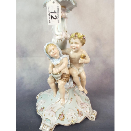 12 - Dresden figural candlestick standing 20 inches tall. Detachable three branch top, Damaged but comple... 