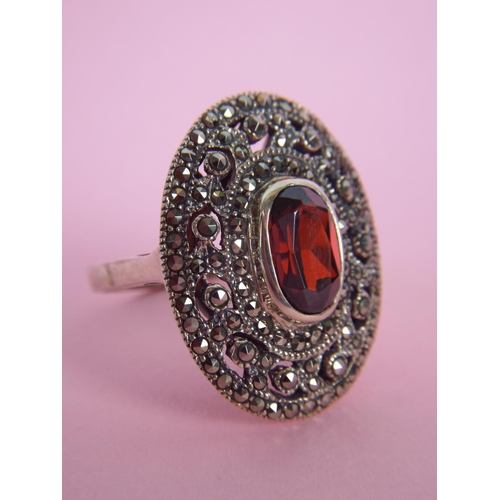 26 - 925 Silver Marcasite Garnet set ring. Finger size 'R'