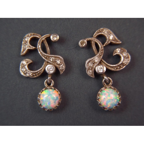 41 - Pair of antique style Silver Opal set marcasite drop earrings.