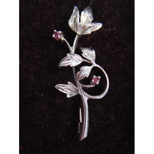 51 - Silver, Ruby set flower brooch.