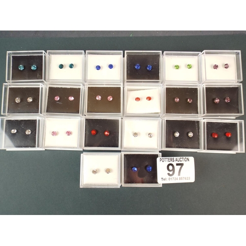 97 - Twenty as new in boxes costume ear studs.