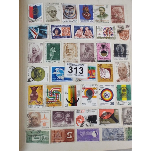 313 - Album of world stamps plus album of first day covers.